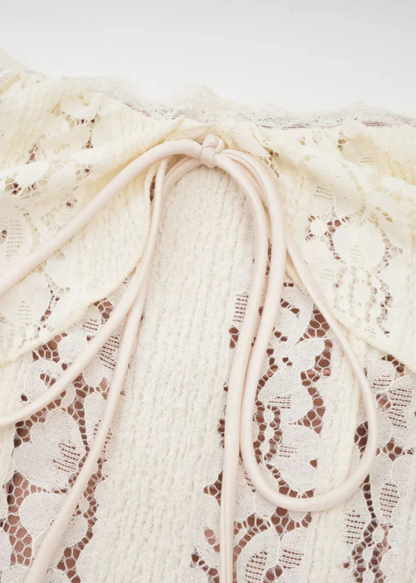 Close-up of a white lace maxi dress